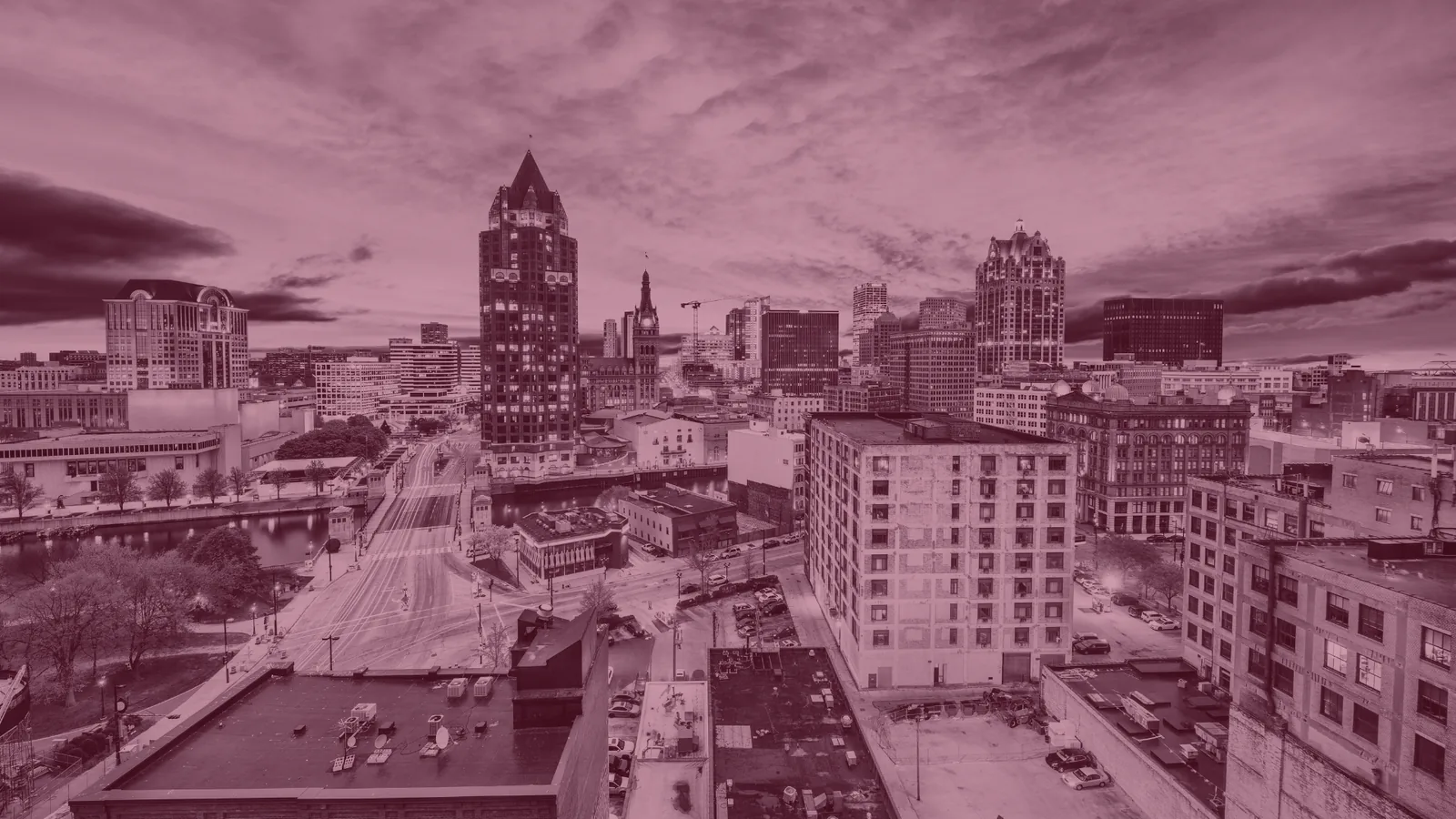 Red-tinted aerial view of a Wisconsin city skyline.